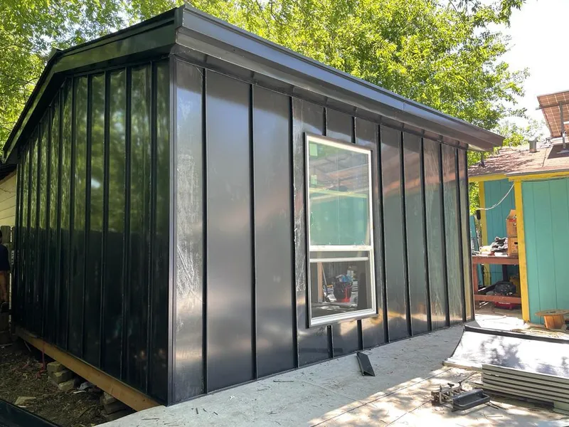 Black standing seam metal wall panels for Roof Inspection in Cornelius