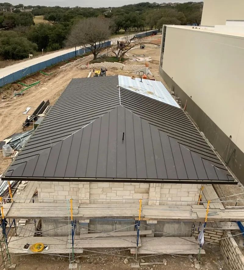 Metal roof new construction with scaffolding in Cornelius